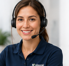 A trained Hannk support agent wearing a headset, ready to answer a live video call